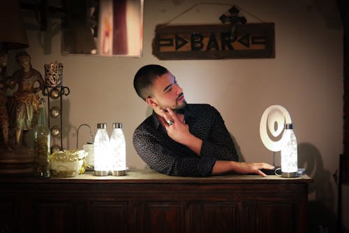 Free Serious young man relaxing in vintage bar Stock Photo
