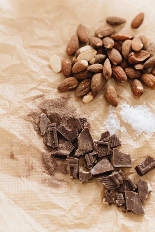 Close-Up Photo Of Chocolate Near Almonds