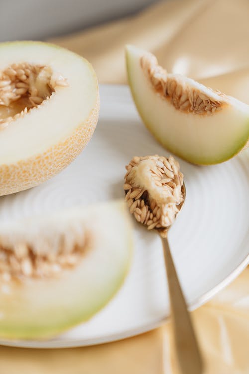 Close-Up Photo Of Spoon With Melon Seeds