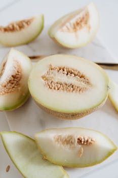 Close-up of fresh sliced melon showcasing the vibrant and juicy interior, ideal for healthy eating.