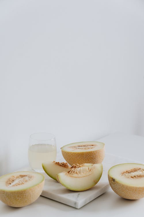 Photo Of Sliced Melon On Marble Surface