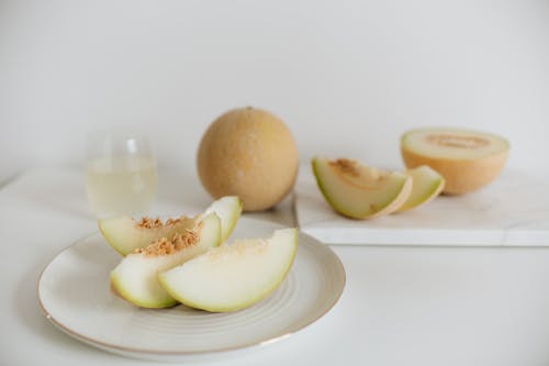 Photo Of Sliced Melon On Plate