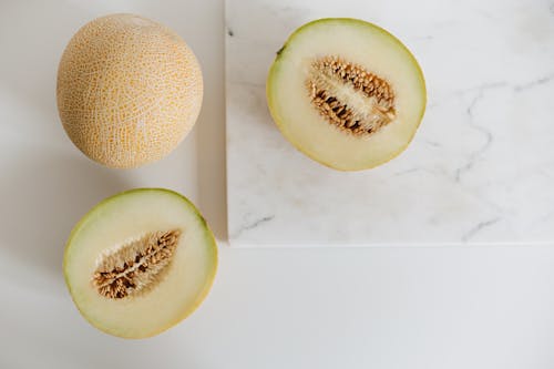 Photo Of Sliced Melon On Marble Surface