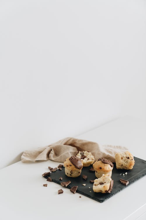 Photo Of Chocolate Muffin Beside Cloth
