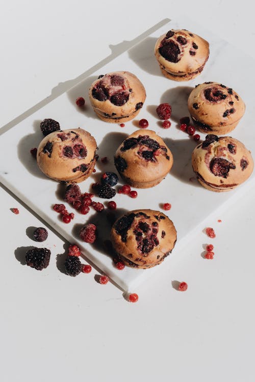Photo Of Berry Muffins On Marble Surface