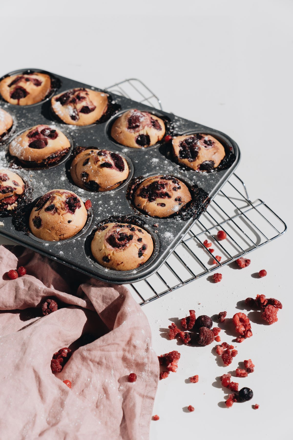 Freshly baked muffins cooling in a baking tin