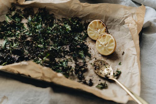 Fired Herb with Lemon and Spoon on Paper