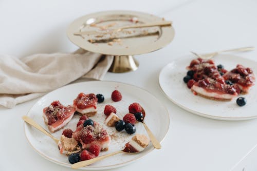 Cakes with Fruits on Plates