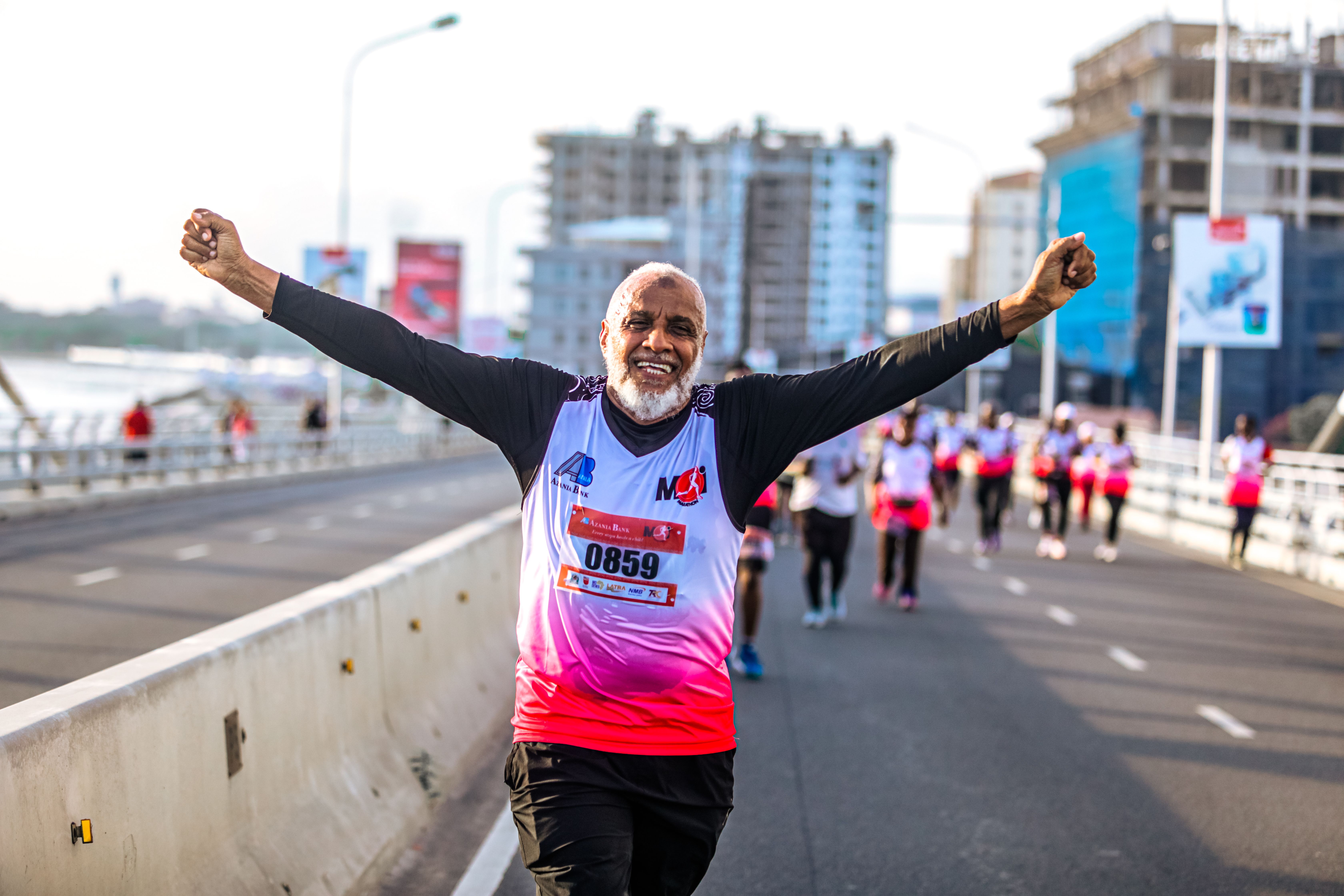Senior Marathon Runner Celebrating Victory · Free Stock Photo
