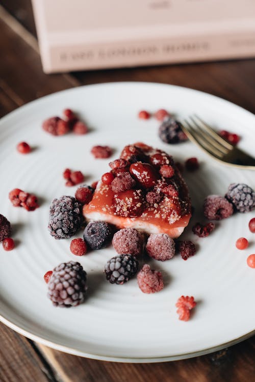 A Sliced Cheesecake with Berries