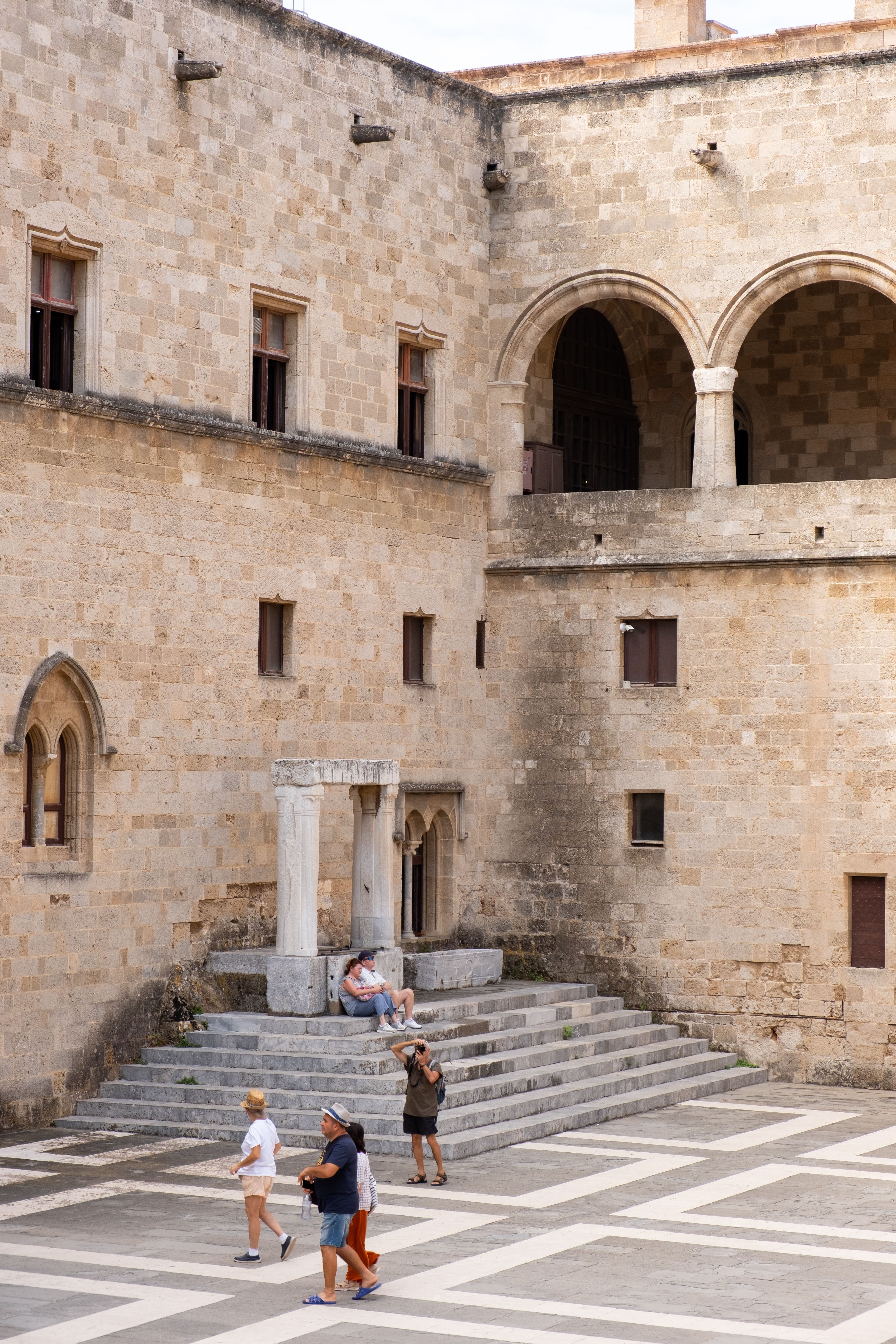 Tourists exploring medieval architecture in Rodos · Free Stock Photo