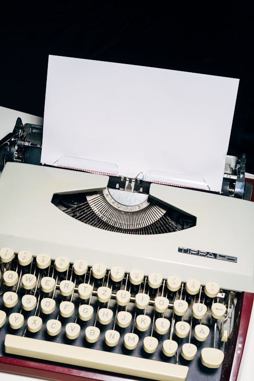 Free White and Black Typewriter on White Table Stock Photo