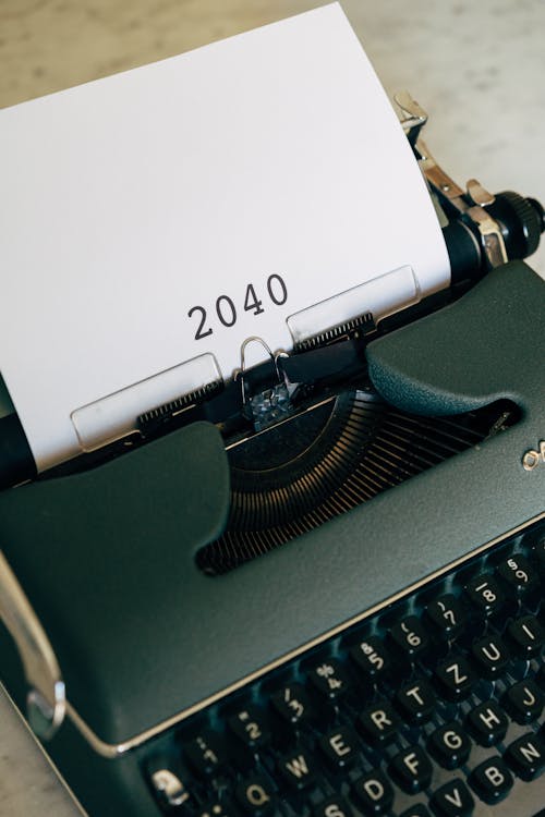 An Old Typewriter With 2040 Typed On Paper 