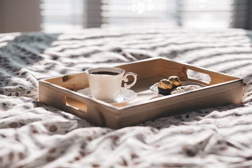 White Teacup on Brown Wooden Tray