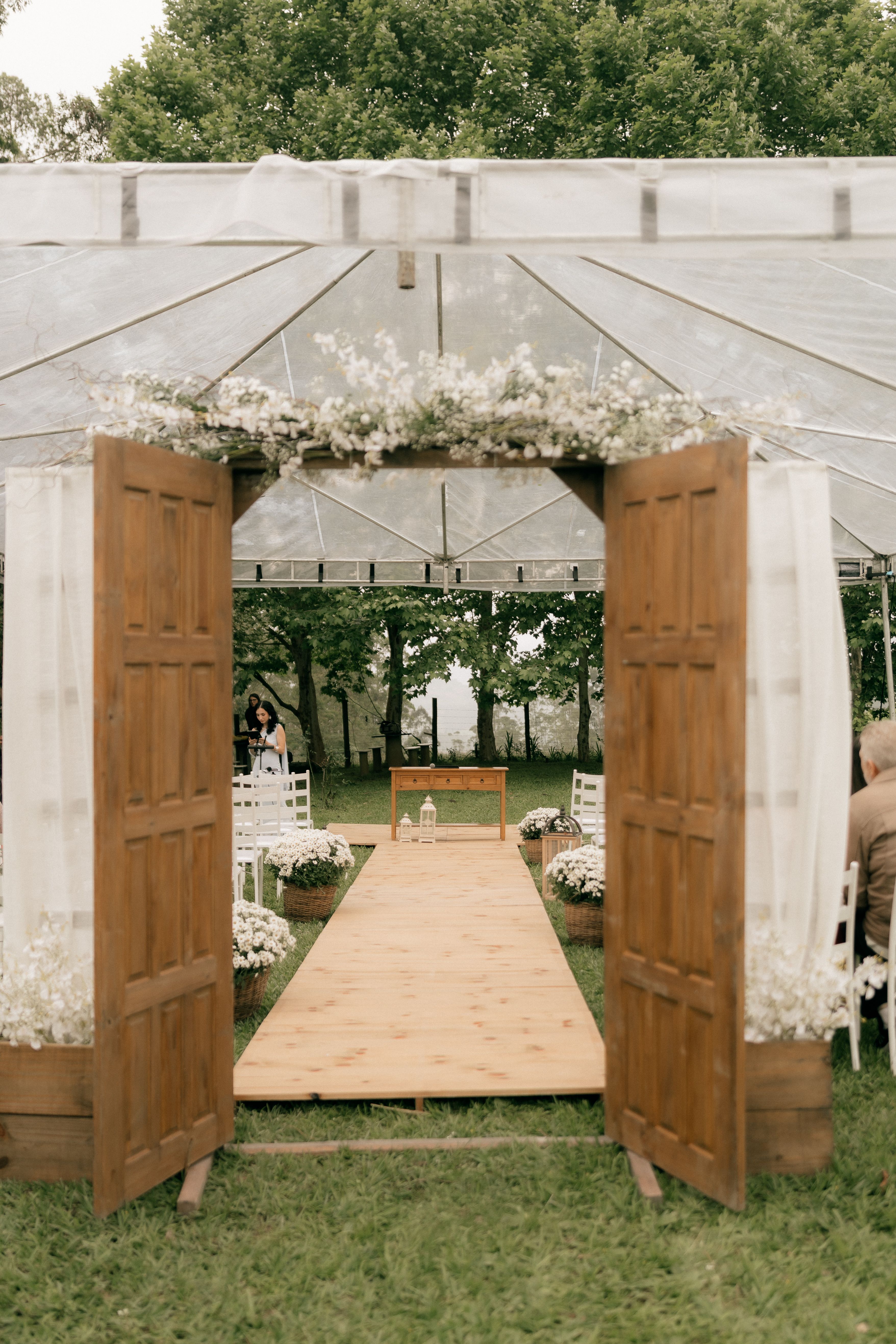 Rustic Outdoor Wedding Aisle with Wooden Doors · Free Stock Photo