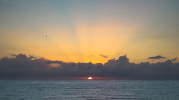 Breathtaking sunrise over Cửa Tùng beach with vivid colors and tranquil sea.