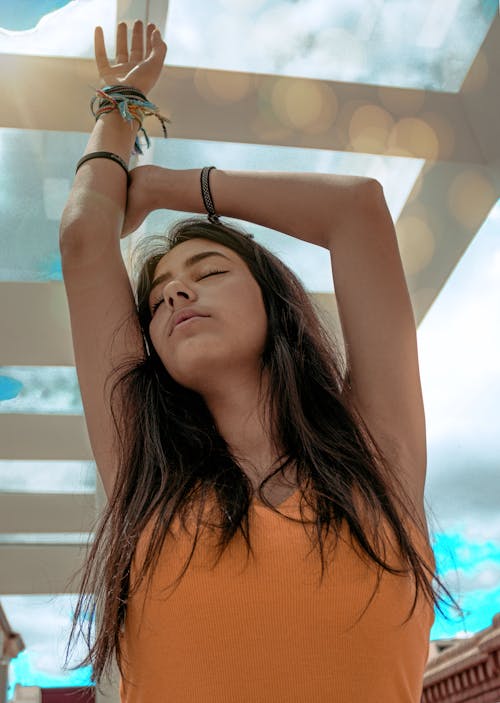 Photo Of Woman Wearing Orange Tank Top