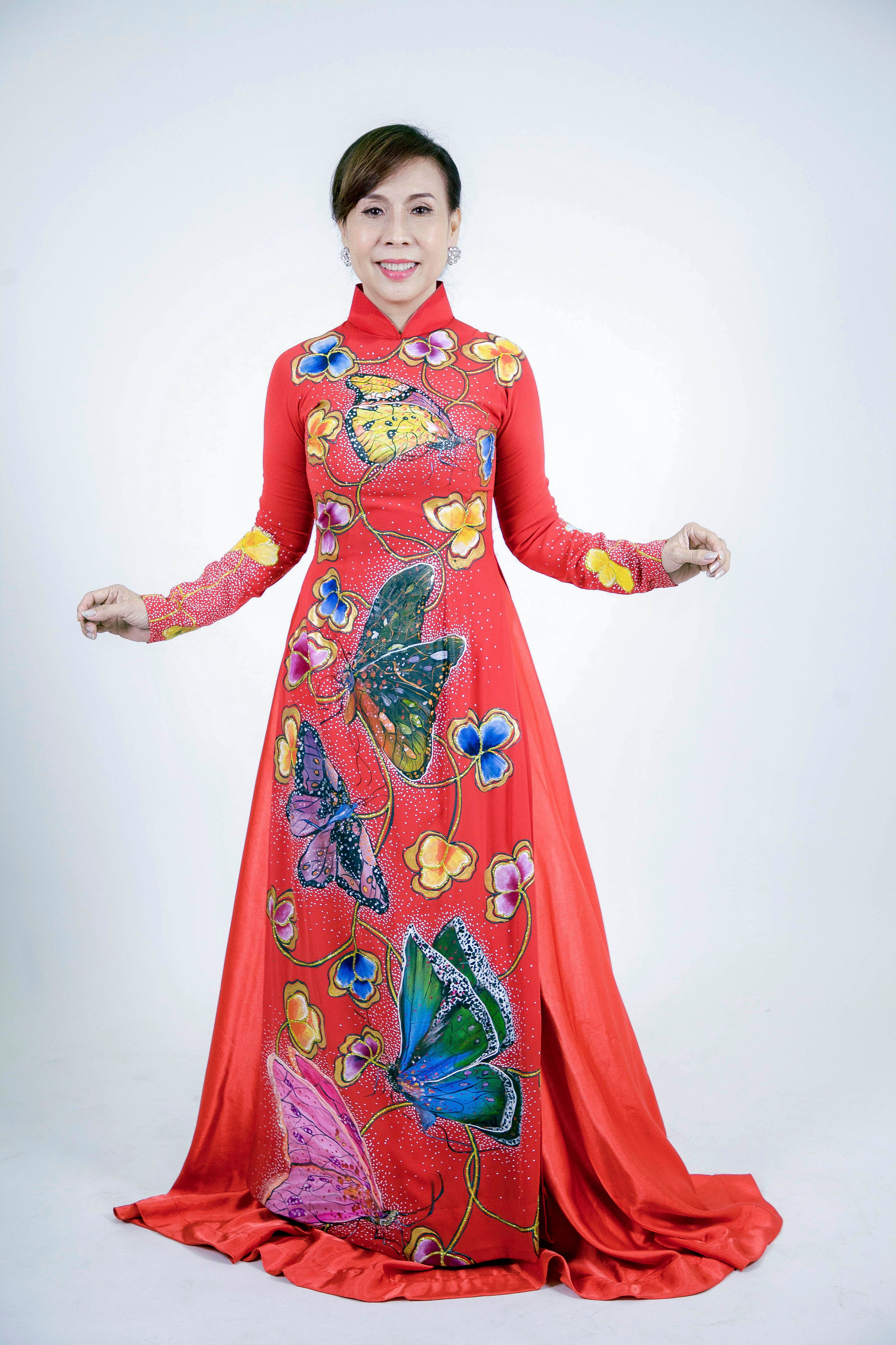Colorful Traditional Dress with Butterfly Patterns · Free Stock Photo