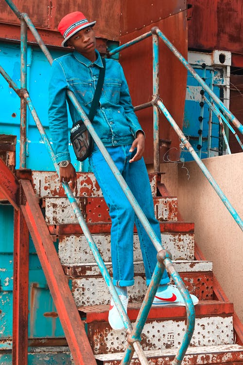 Photo Of Man Leaning On Handrail