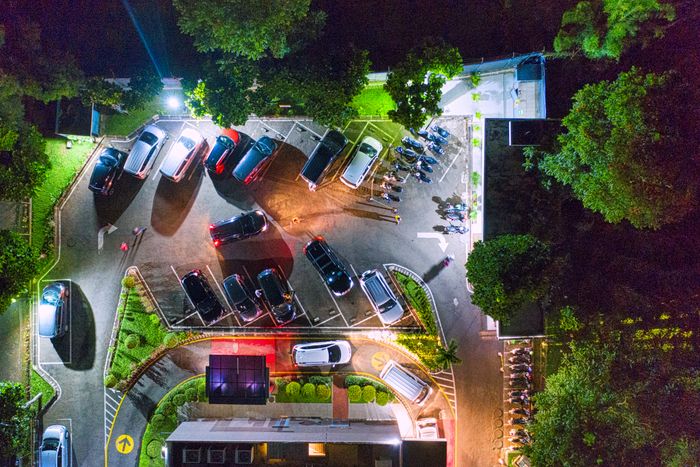 Aerial night view of a shopping mall parking lot