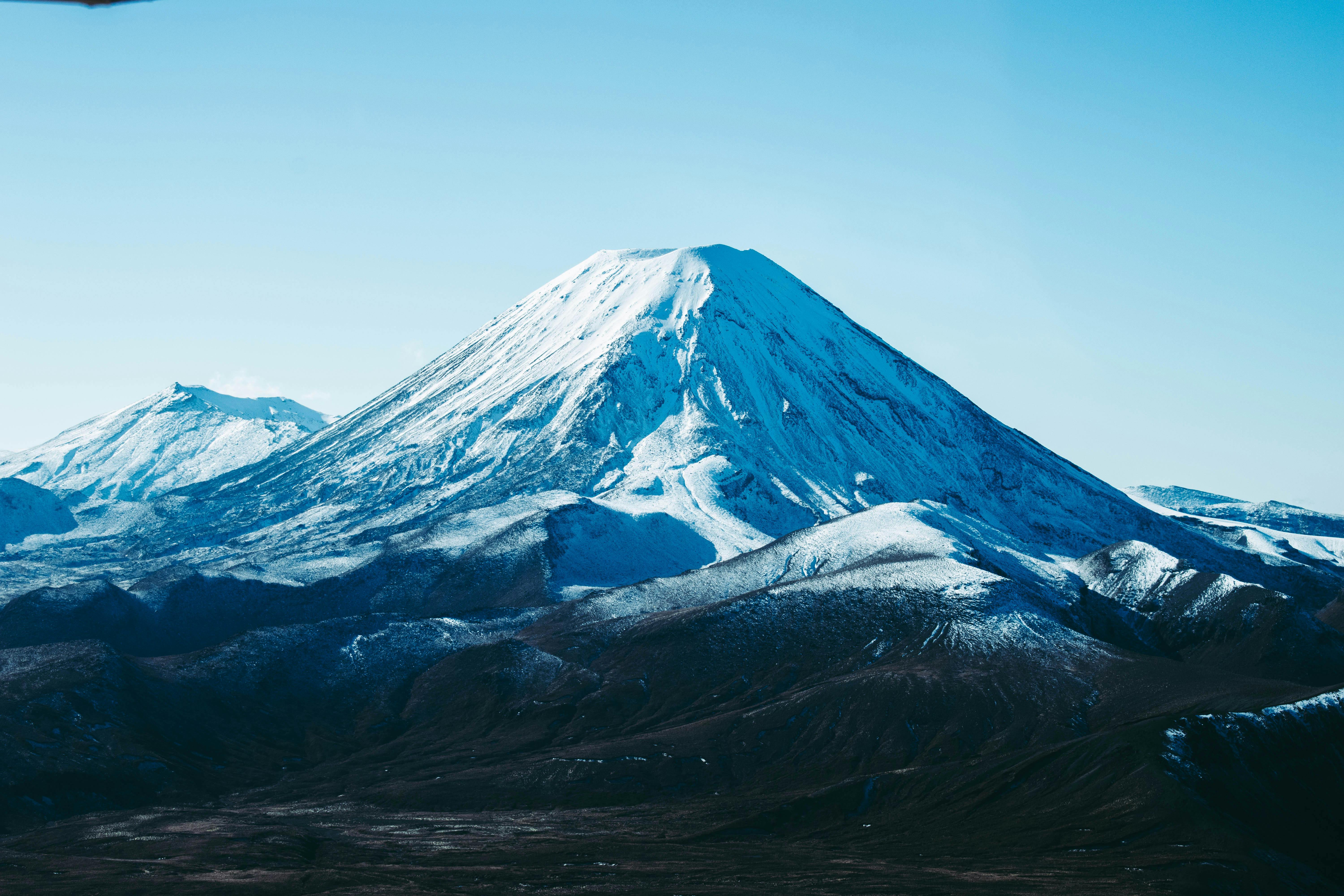 Prescription Goggle Inserts - Majestic snow-capped mountain in Tongariro National Park, New Zealand, under a clear blue sky.