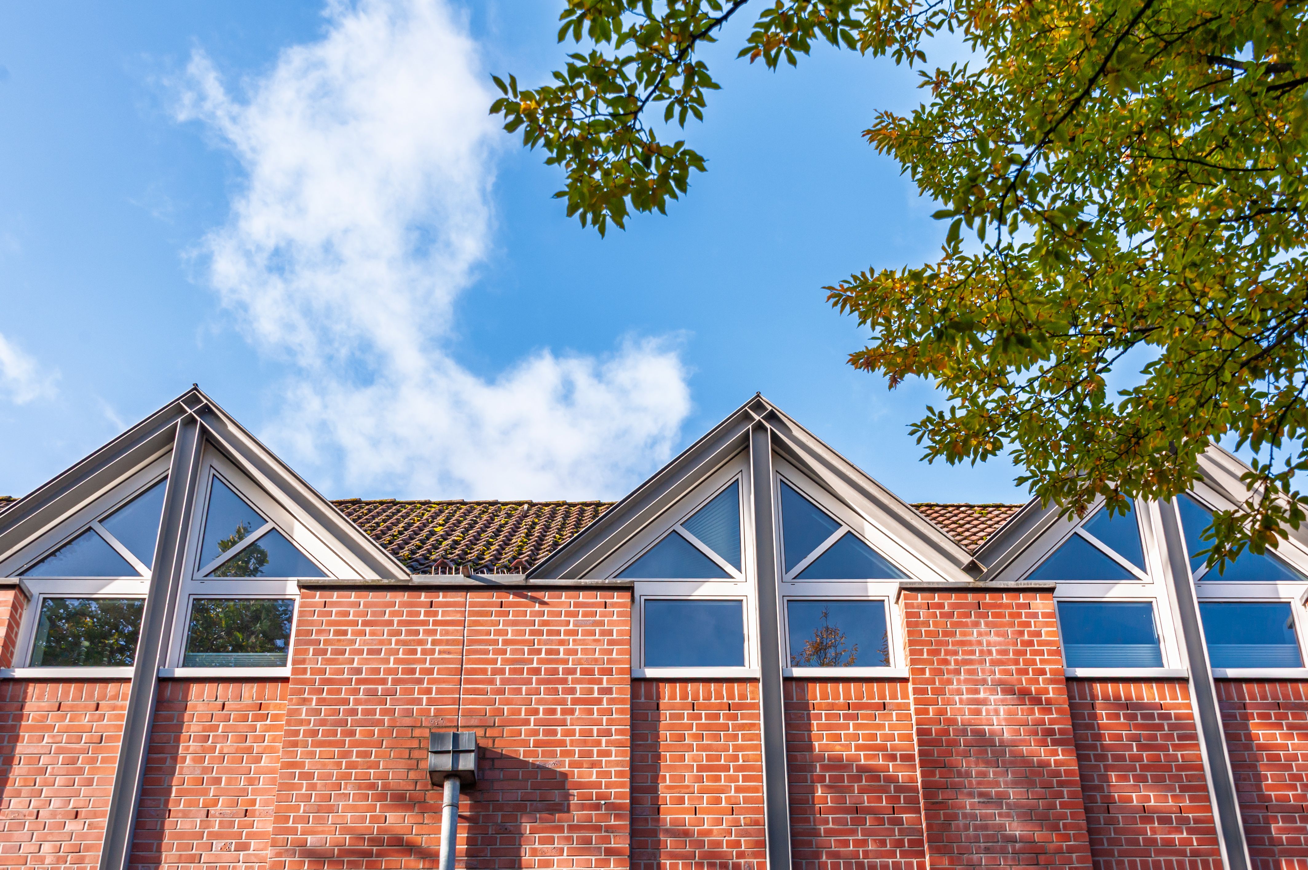Modern Brick Building with Triangle Windows · Free Stock Photo