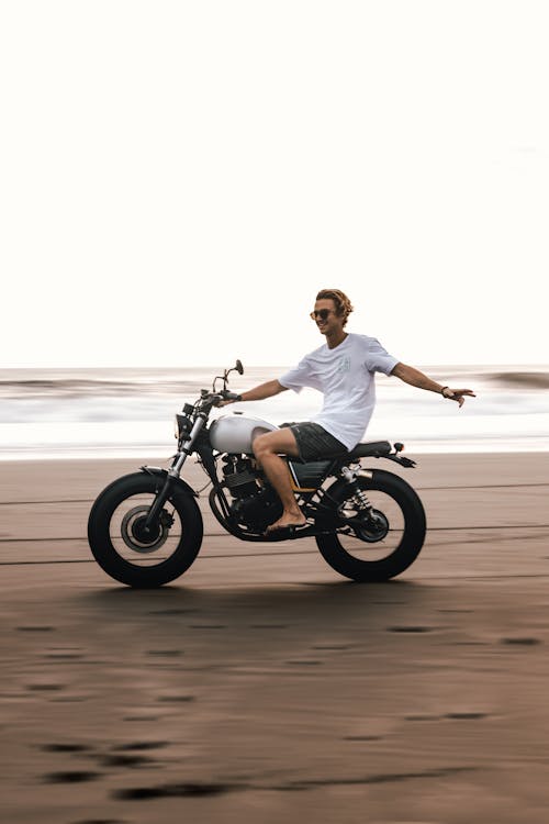 Photo Of Man Riding Bicycle