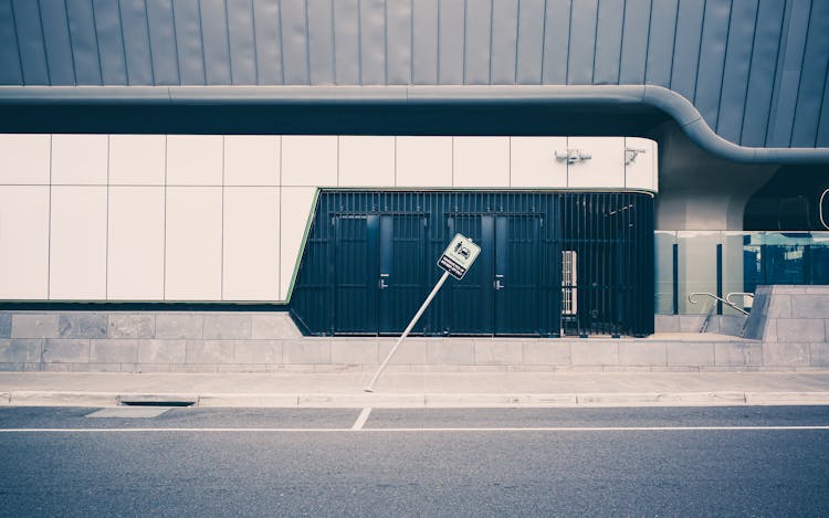 Bent Road Sign At Airport