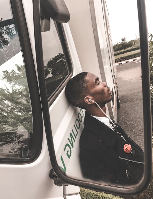 Photo Of Man Leaning On Truck 