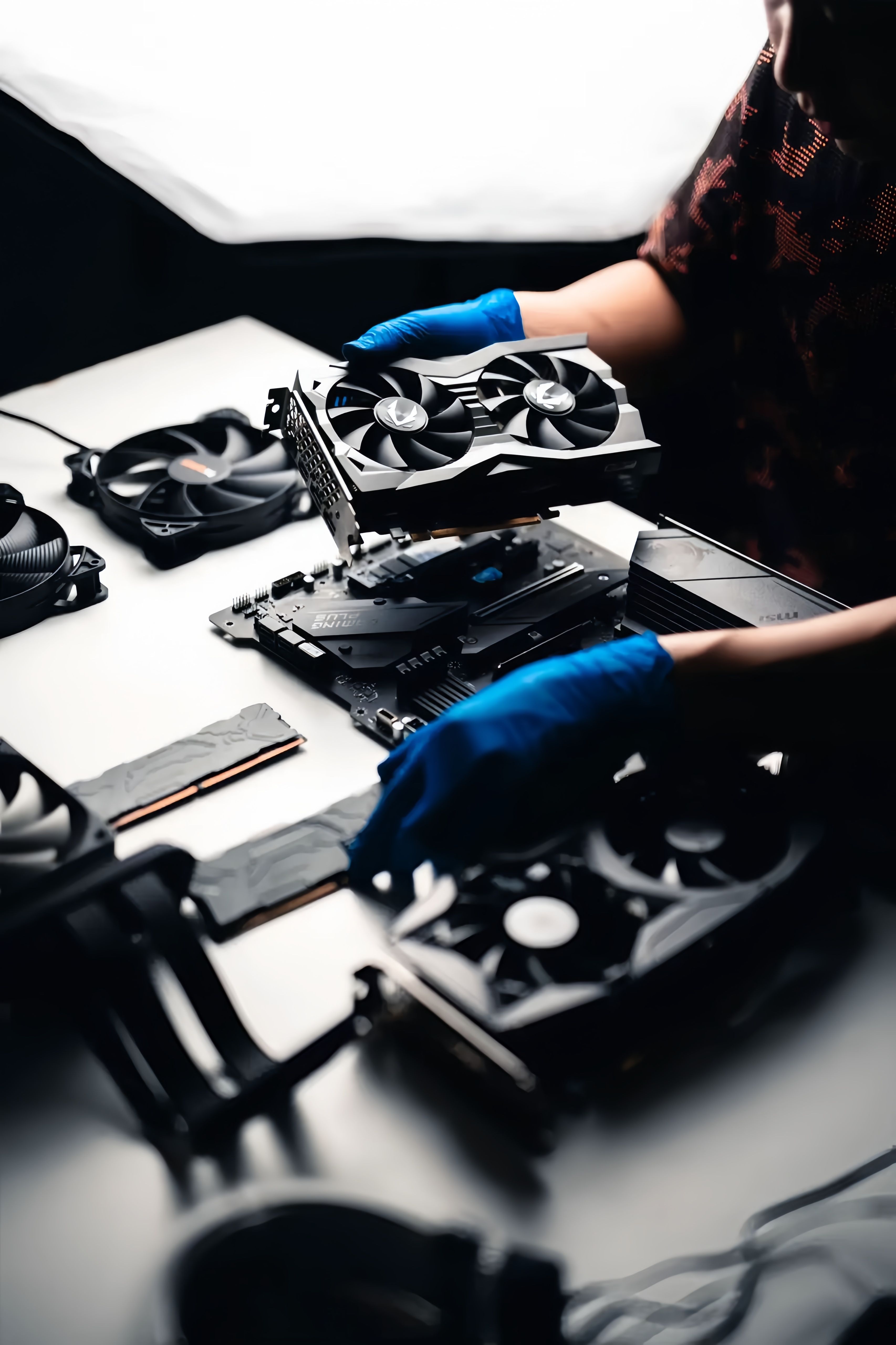 Technician Assembling Computer Hardware Components · Free Stock Photo