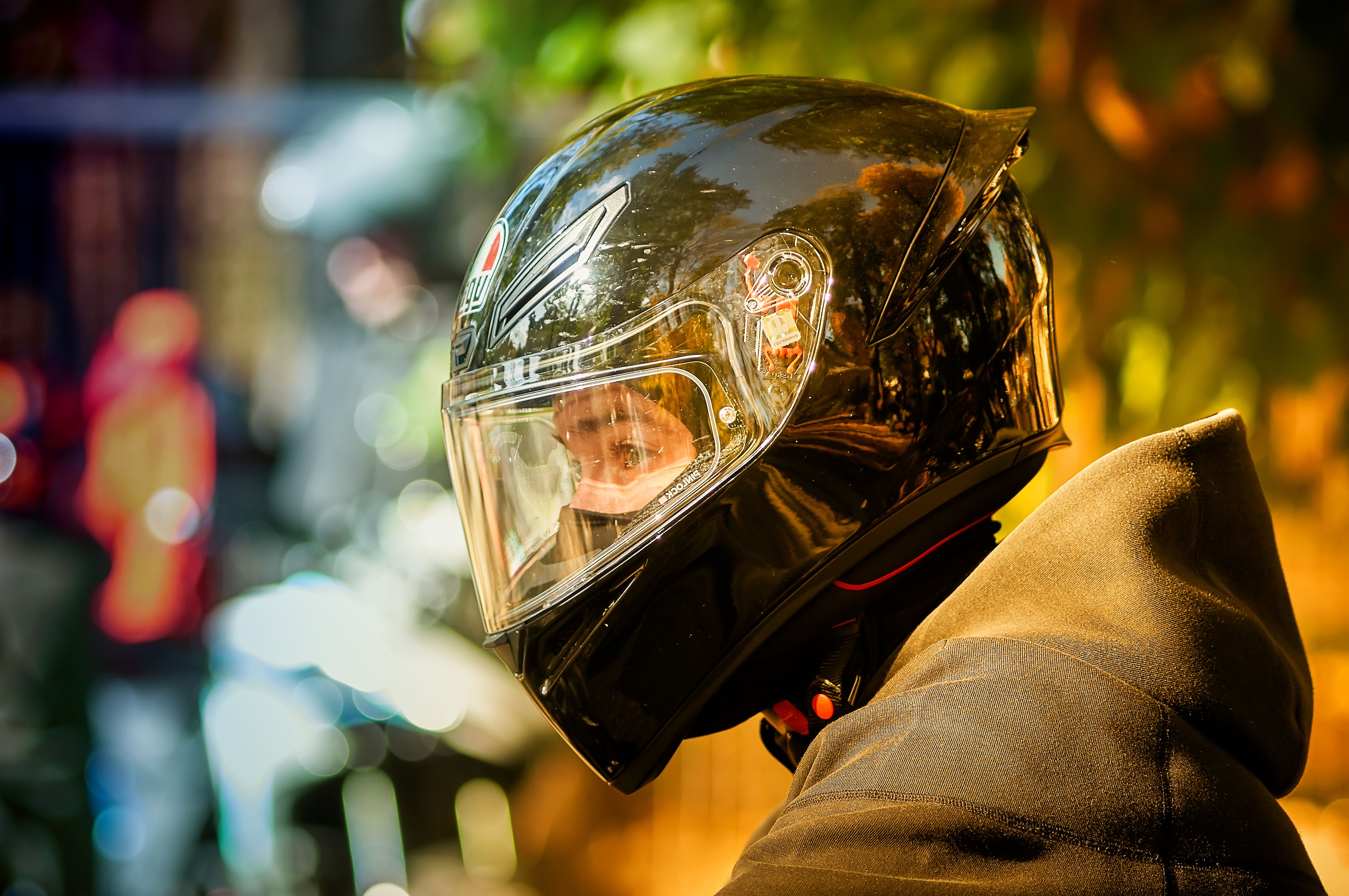 Motorcyclist in Helmet with Bright Background · Free Stock Photo