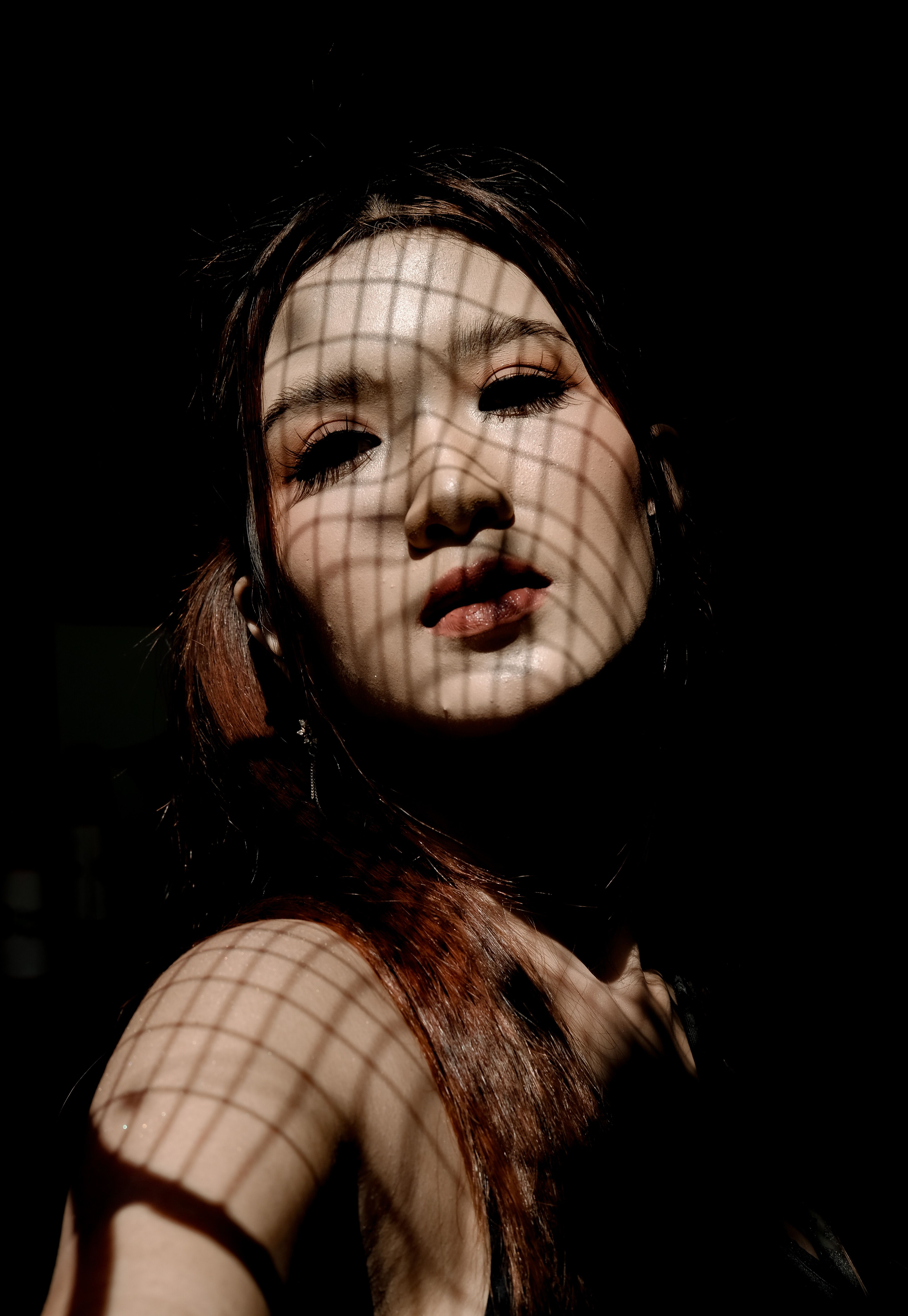 Artistic Portrait with Dramatic Shadow Patterns · Free Stock Photo