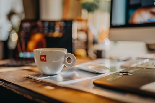A cozy home office desk setup with a cup of coffee, perfect for a productive morning.