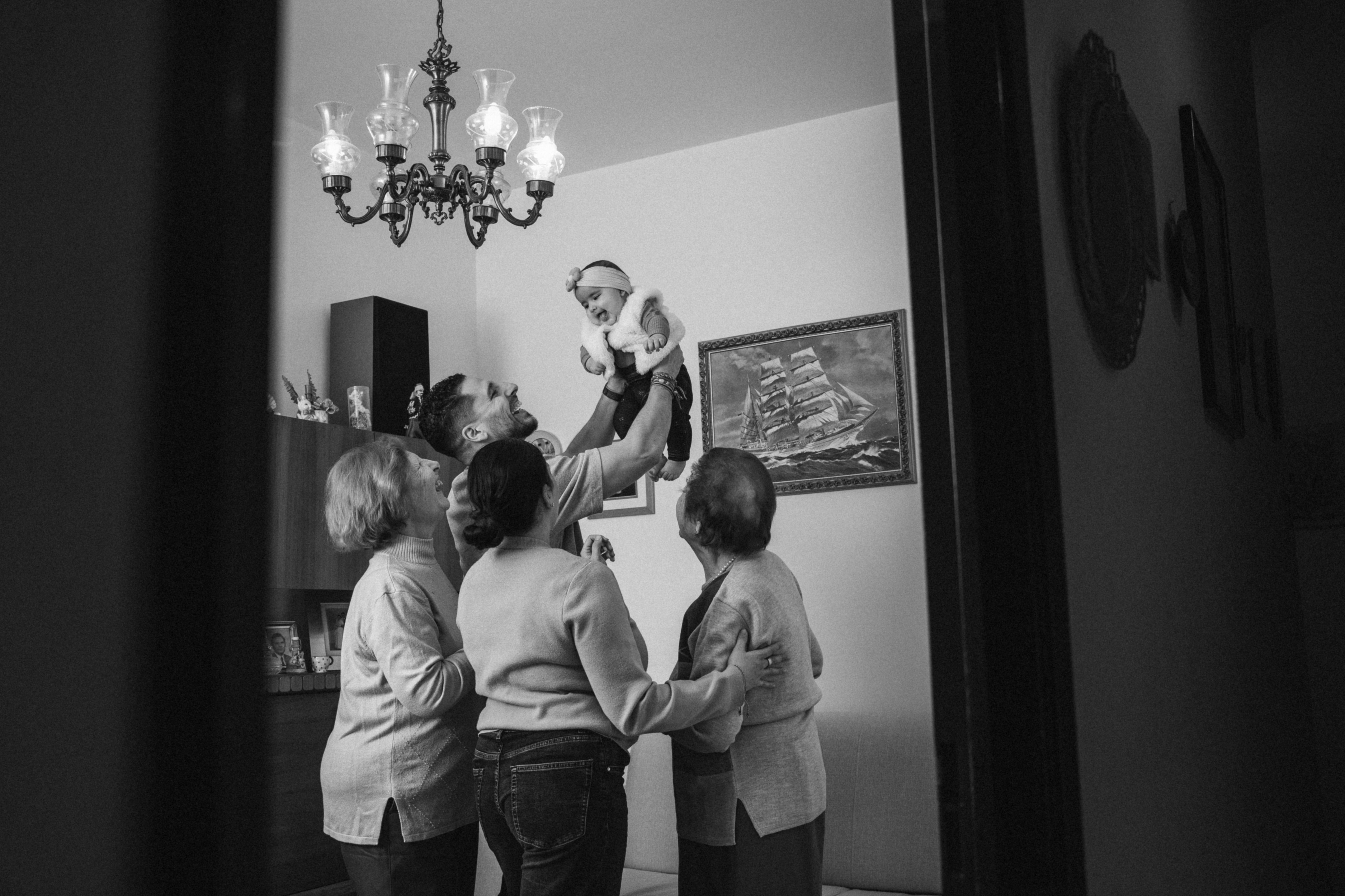 Black and White Family Gathering in Living Room · Free Stock Photo