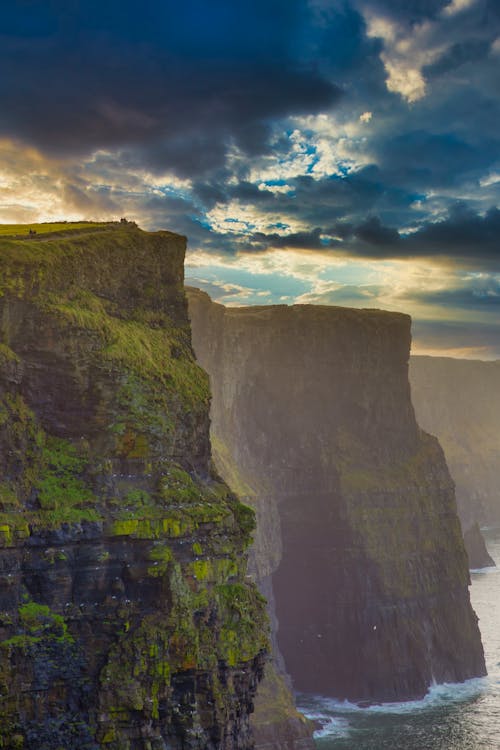 Photo Of Cliff Side During Dawn 