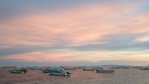 Boats on Sea During Sunset