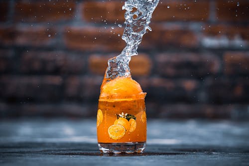 Clear Drinking Glass With Orange Liquid