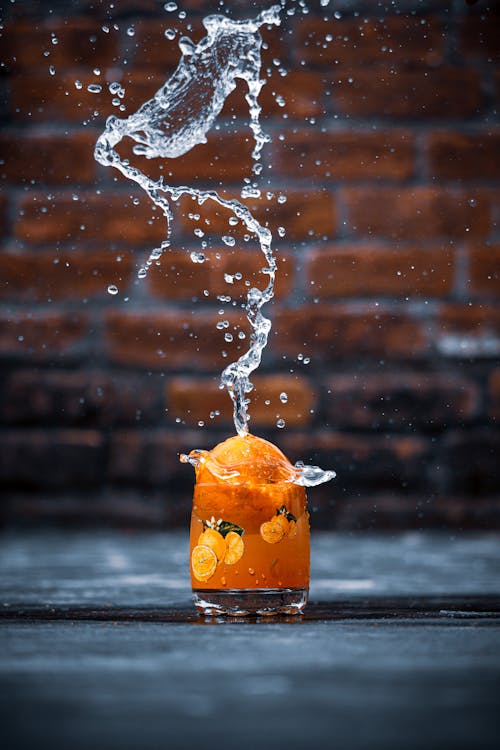 Free Orange Juice in Clear Drinking Glass Stock Photo