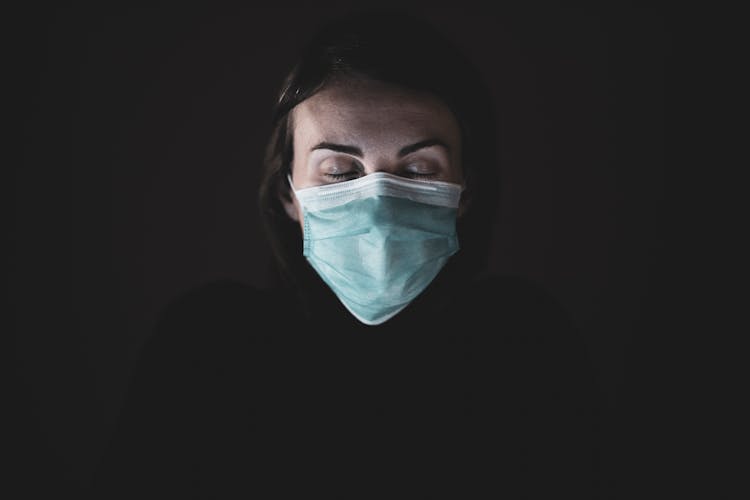 Woman In Black Shirt And Face Mask