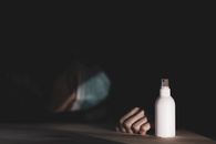Person Near White Plastic Spray Bottle