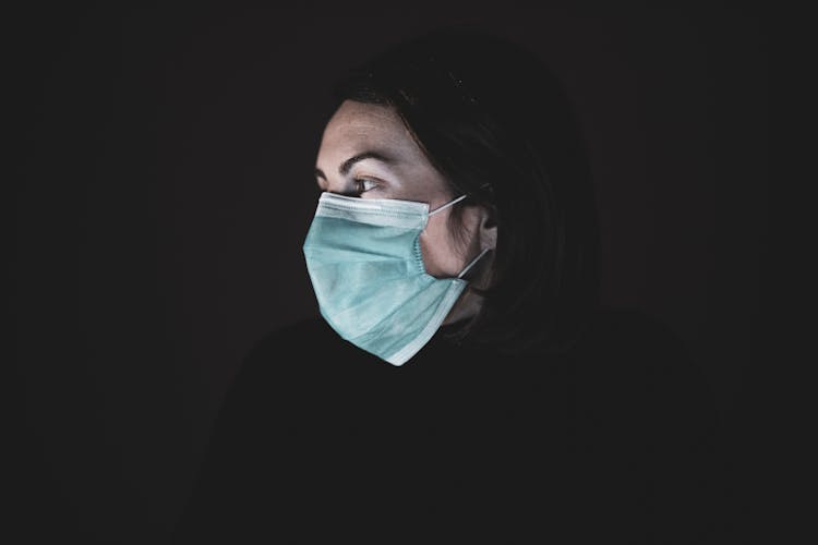 Woman In Black Shirt Wearing Face Mask
