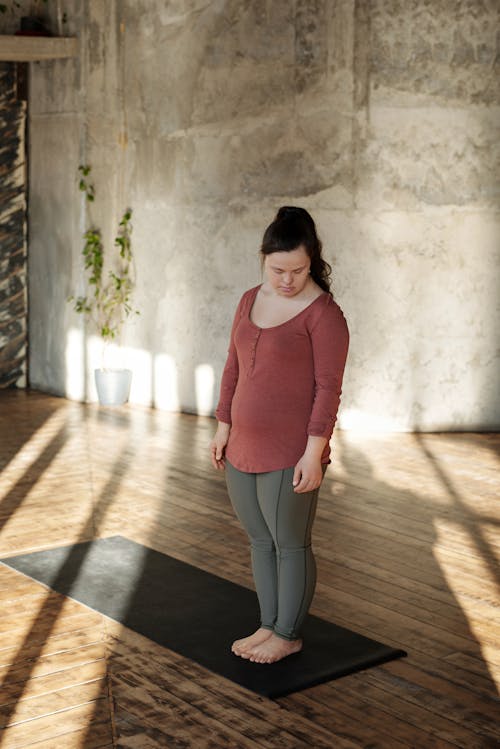 Woman Standing on Yoga Mat