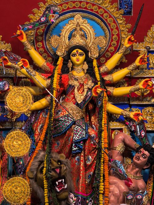 Free Colorful and intricate Durga Puja idol displaying cultural artistry with vibrant colors and ornate decorations. Stock Photo