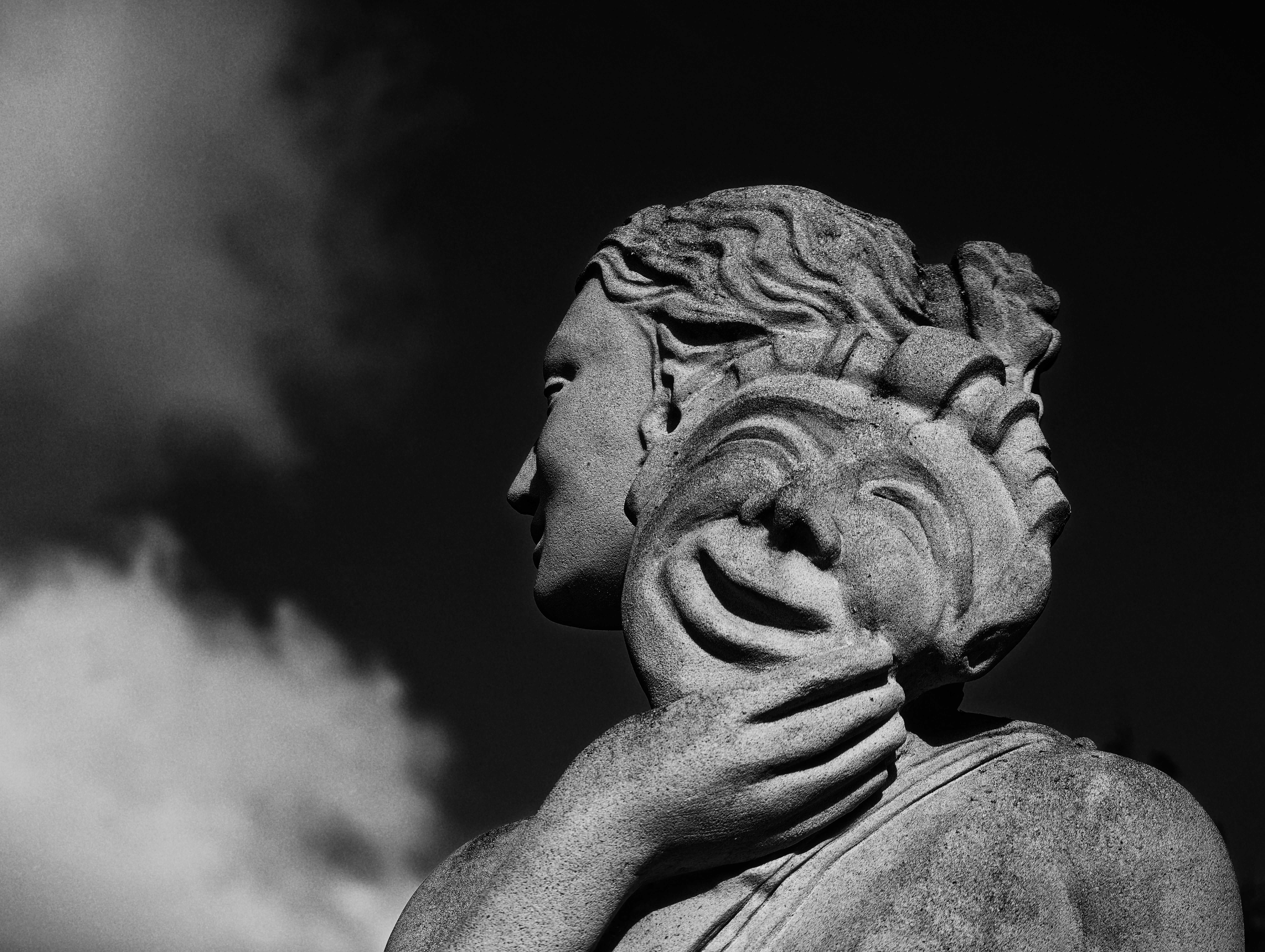 Emotional Contrast Stone Sculpture in Black and White · Free Stock Photo