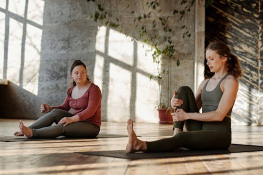Women practicing yoga in a sunlit studio, promoting inclusivity and wellness.