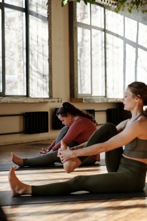 Photo Of Women Stretching Together