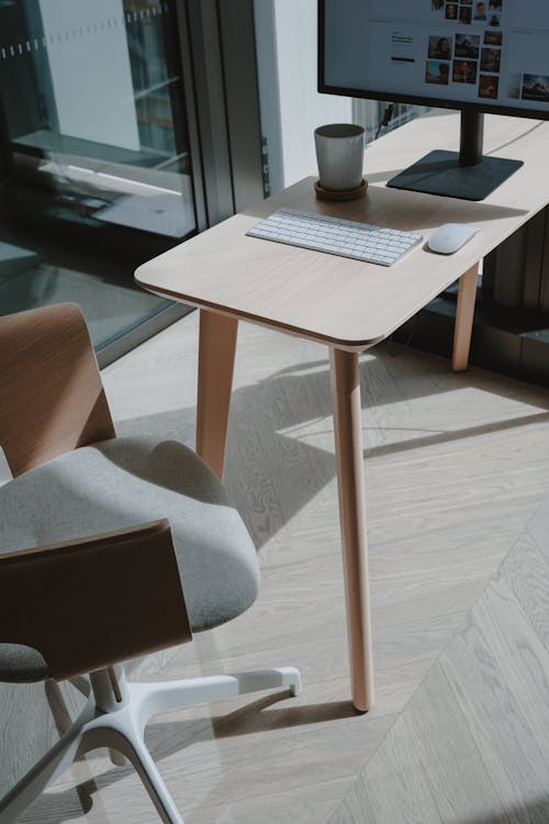 White Ceramic Mug on Brown Wooden Table