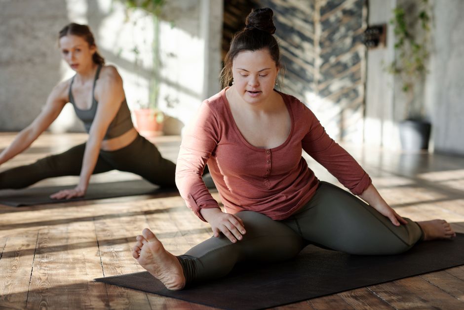 a person engaging in a healthy lifestyle activity like yoga or stretching, with a focus on joint flexibility - peptide and collagen