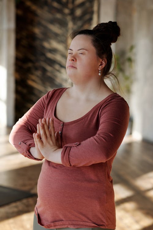 Young Woman In A Meditating Position