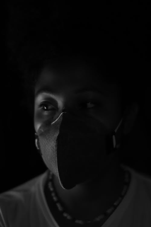 Grayscale Photo of Man Wearing Black Face Mask